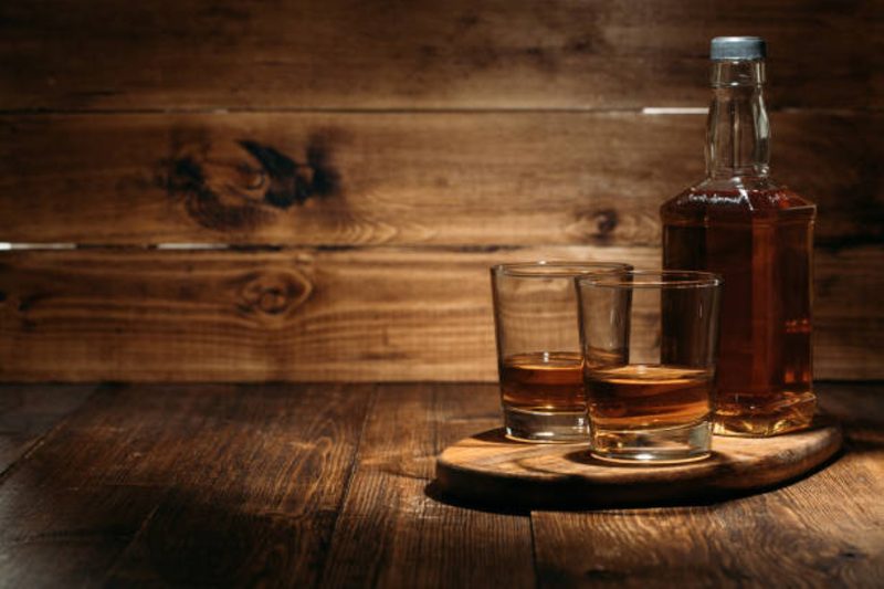 Rum on a wooden background
