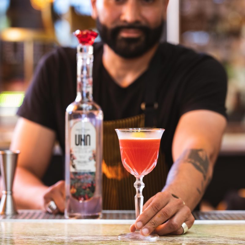 Strawberry Frida mixed cocktail with UNA Vodka at bar