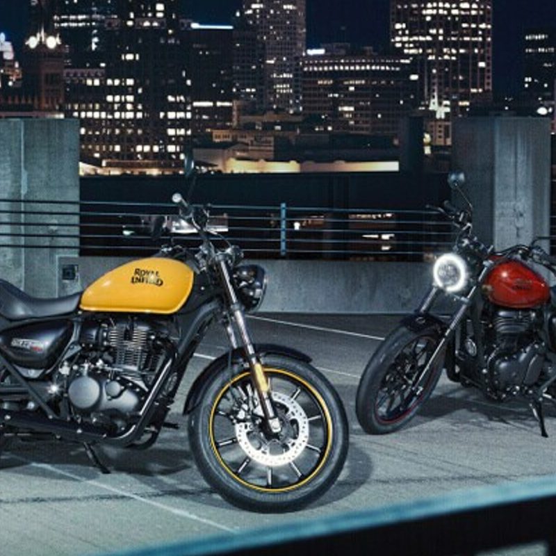Two 2024 Royal Enfield Meteor 350s parked on a city rooftop