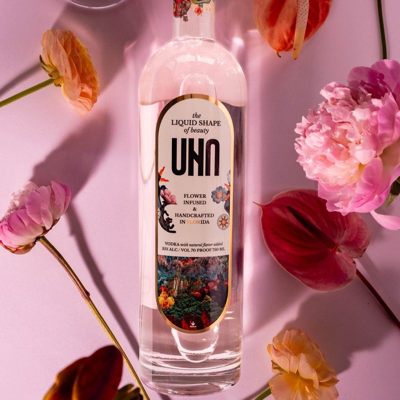 UNA Vodka rose color and bottle up close