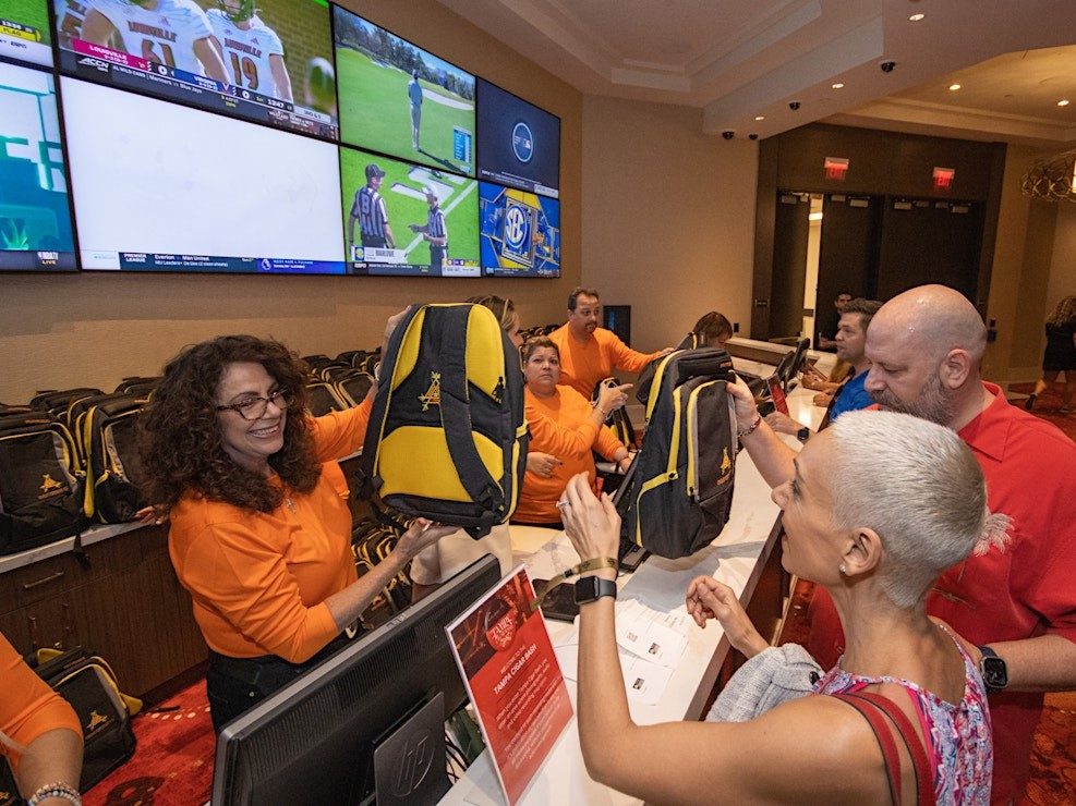 Vendors handing out Casa de Montecristo bags at Tampa Bay Cigar Bash 2023