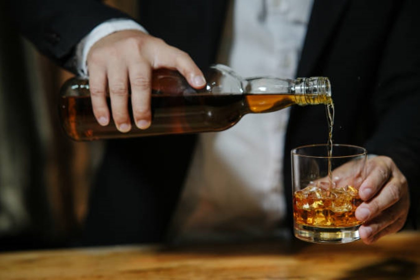 Whiskey pouring into a glass