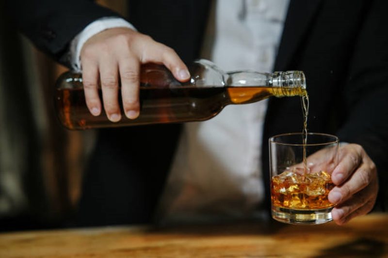 Whiskey pouring into a glass
