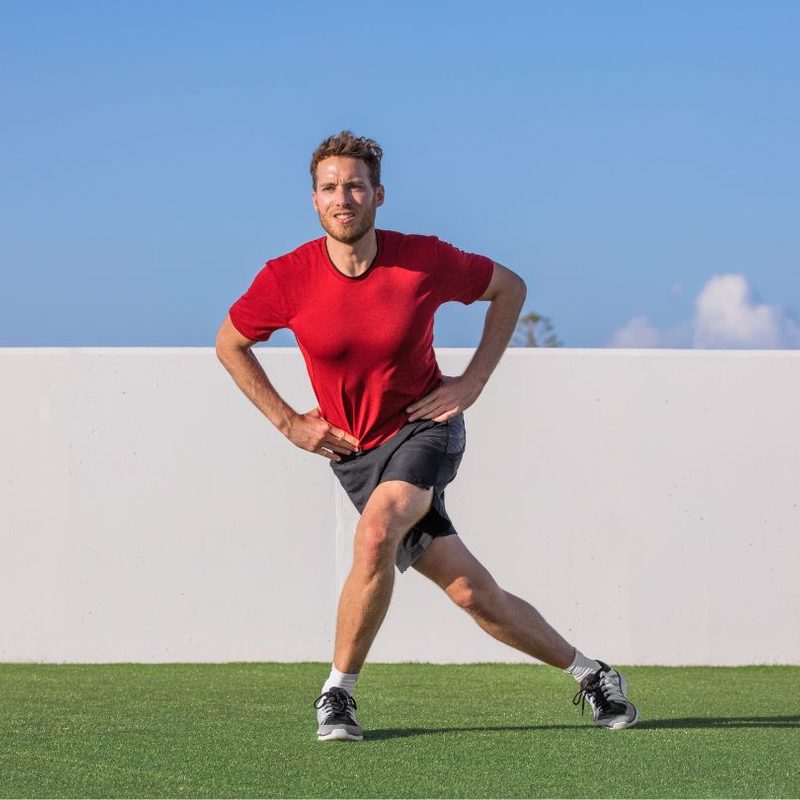 Man doing lunges in the park
