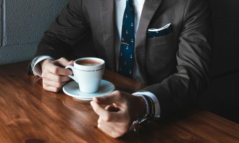 Man drinking a cup of coffee