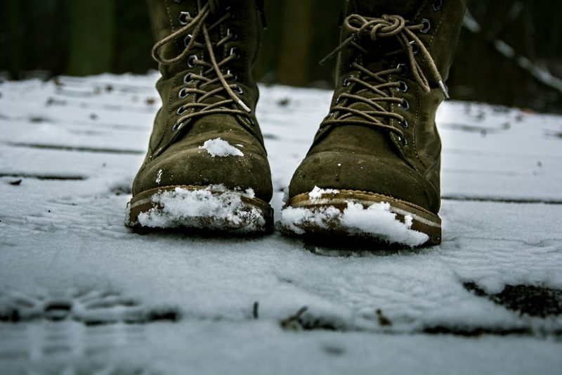 Green suede boots in snow