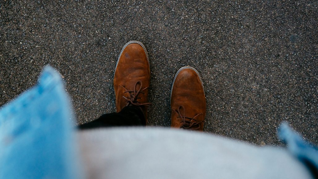 person wearing brown suede boots