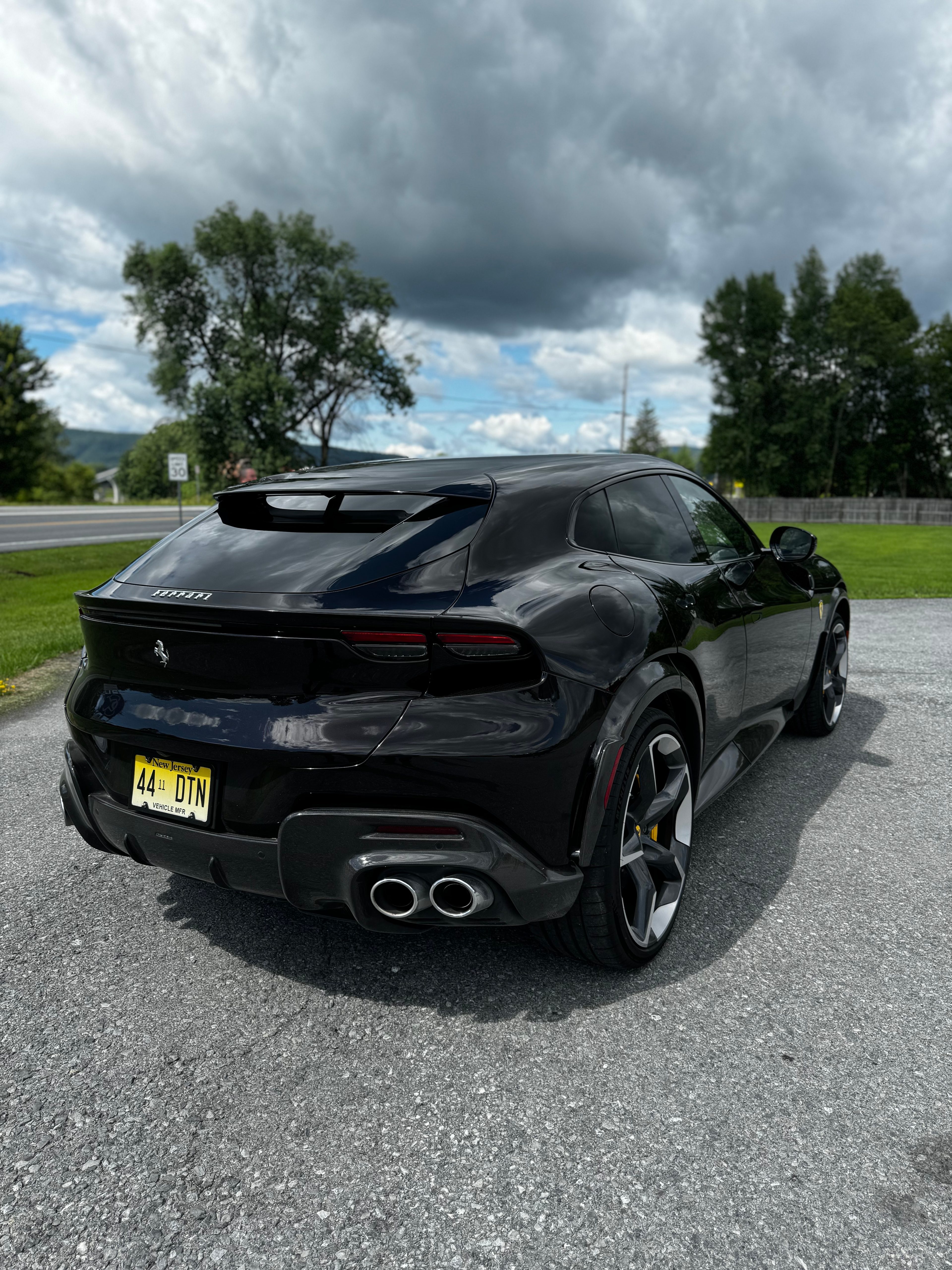 Black Ferrari Purosangue from back