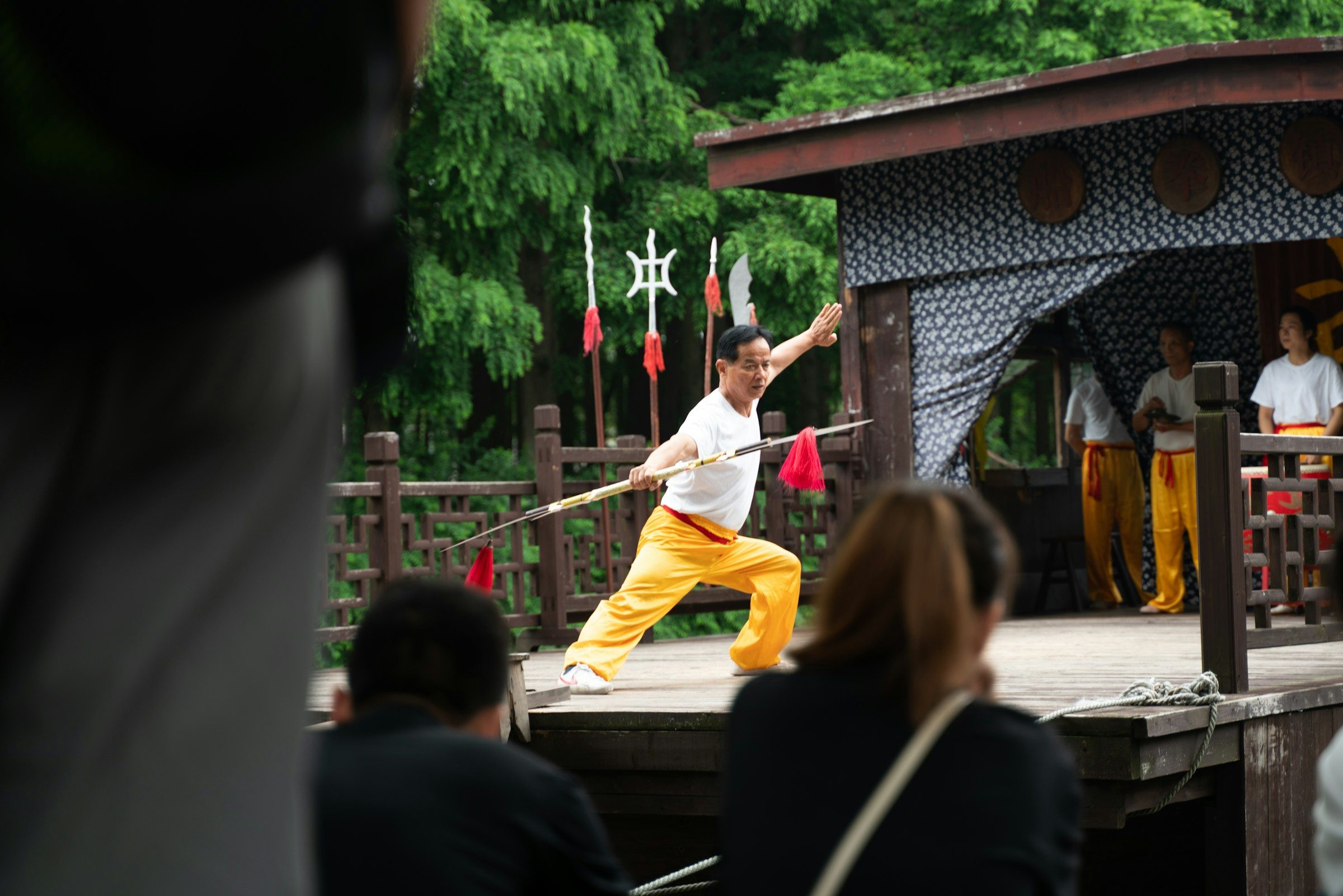 man wearing yellow and white performing dancing Qigong martial arts China