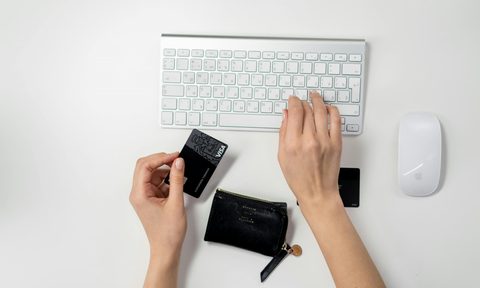 a person paying for something online with a credit card