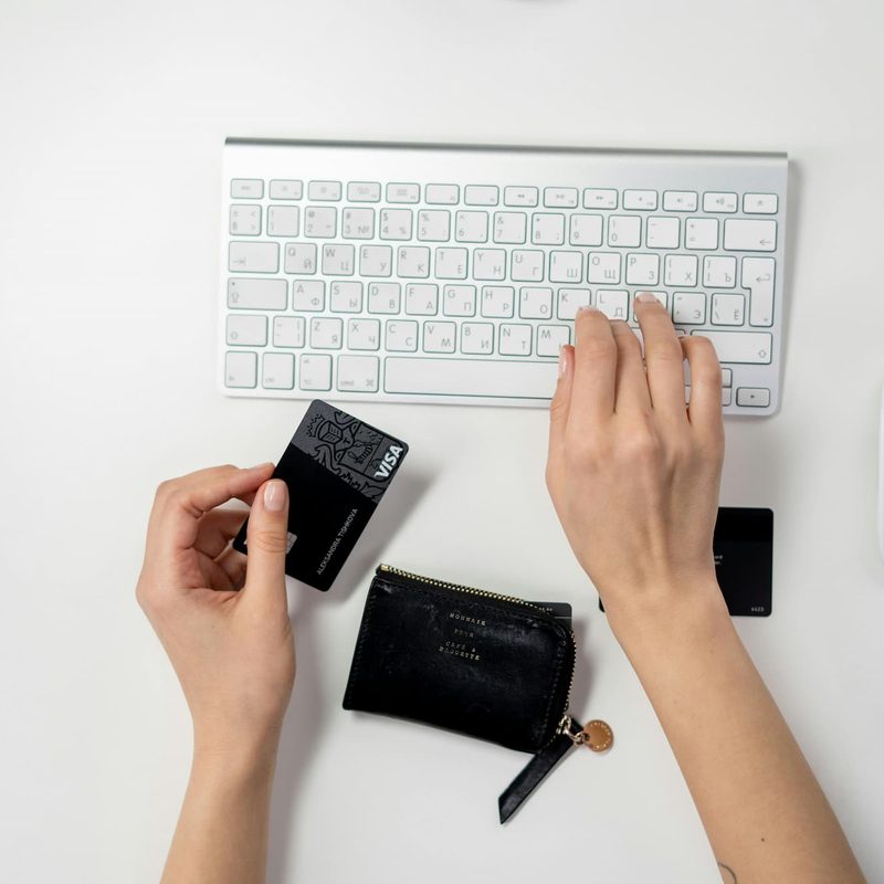 a person paying for something online with a credit card