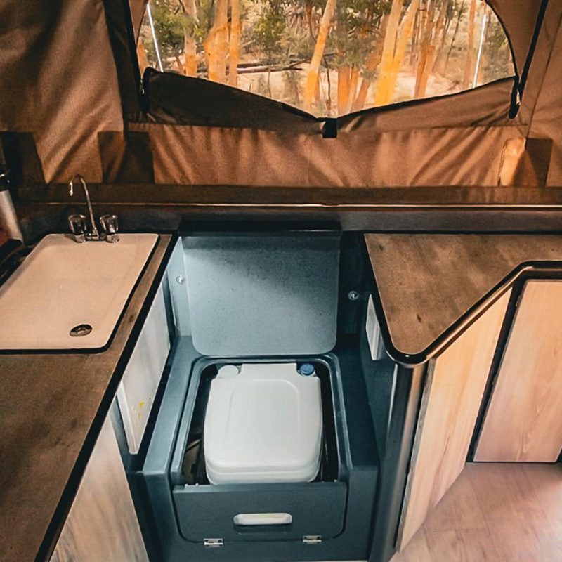 Compact bathroom inside the Invader Duo X off-road camper.