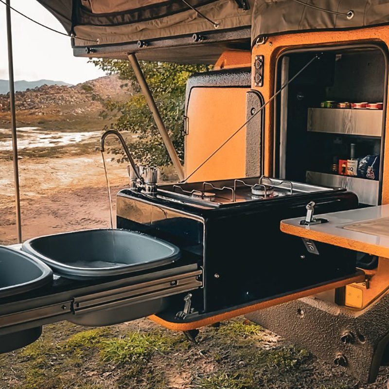 Slide-out outdoor kitchen of Invader's Duo X off-road camper.