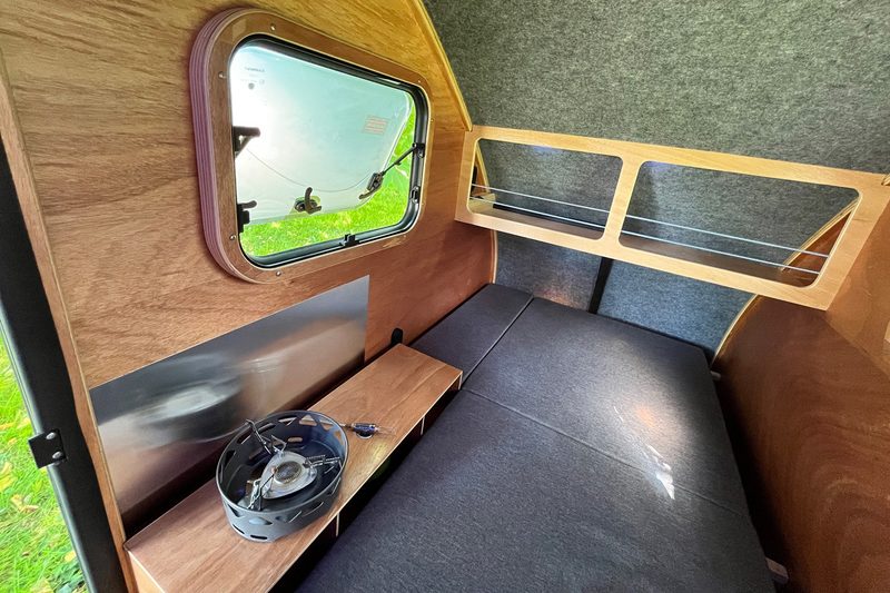 Interior of the i:woody wooden bike-friendly teardrop travel trailer.