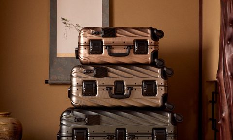 three suitcases stacked on top of each other