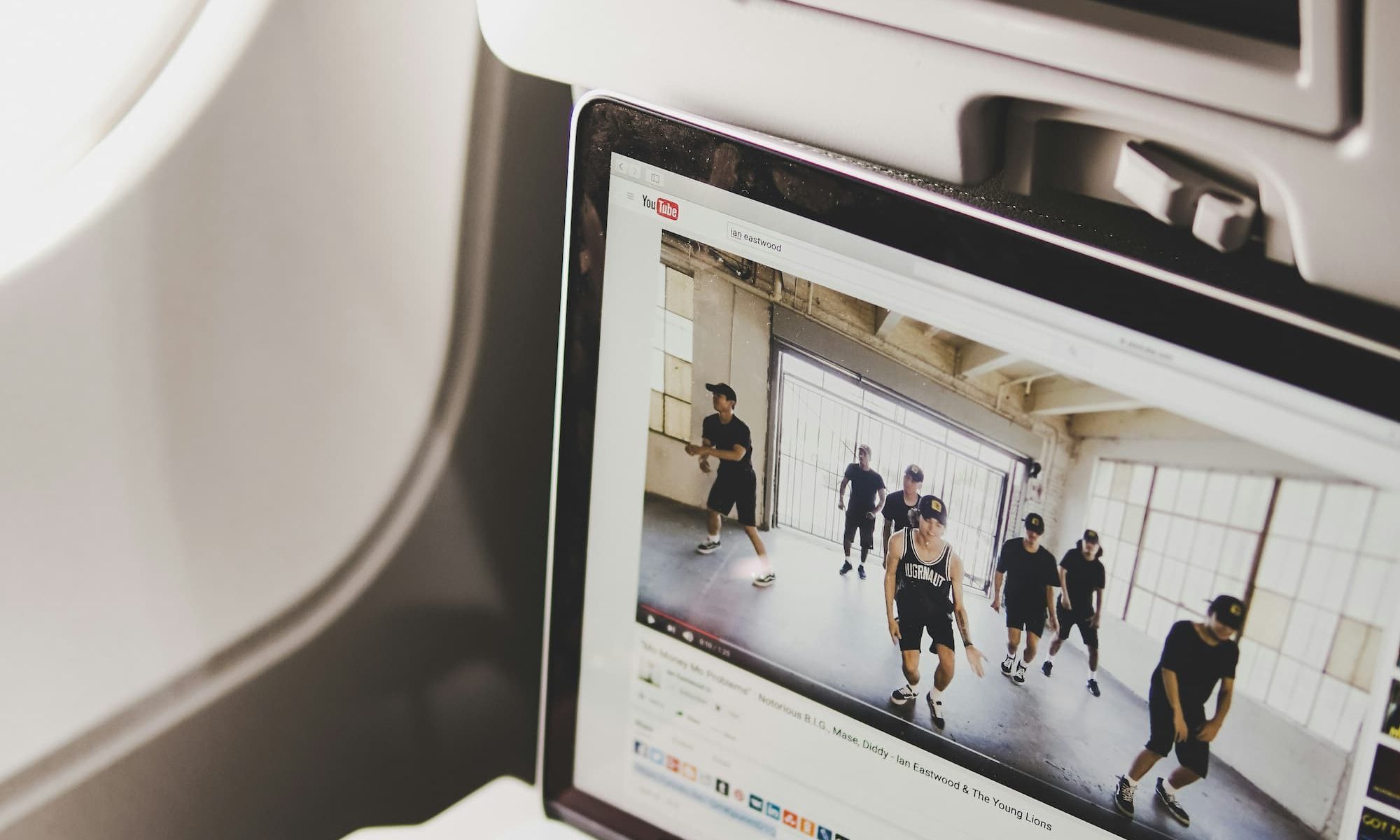 black headphones on a laptop in plane