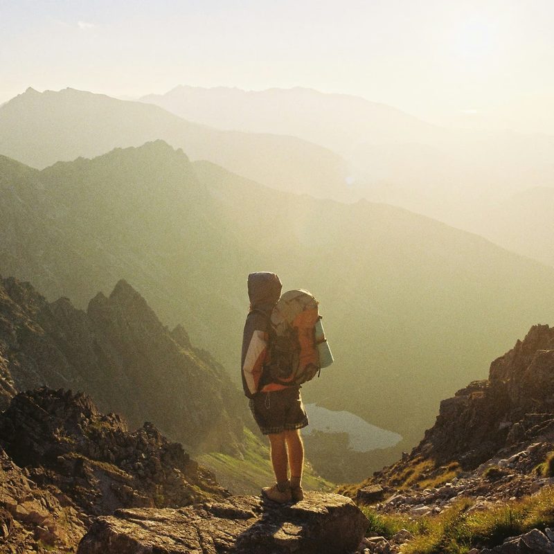 Man standing outside with backpack on