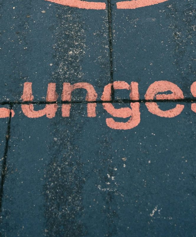sign on ground in red saying lunges with illustration