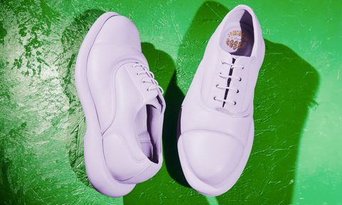 lilac padded oxford shoes on green table