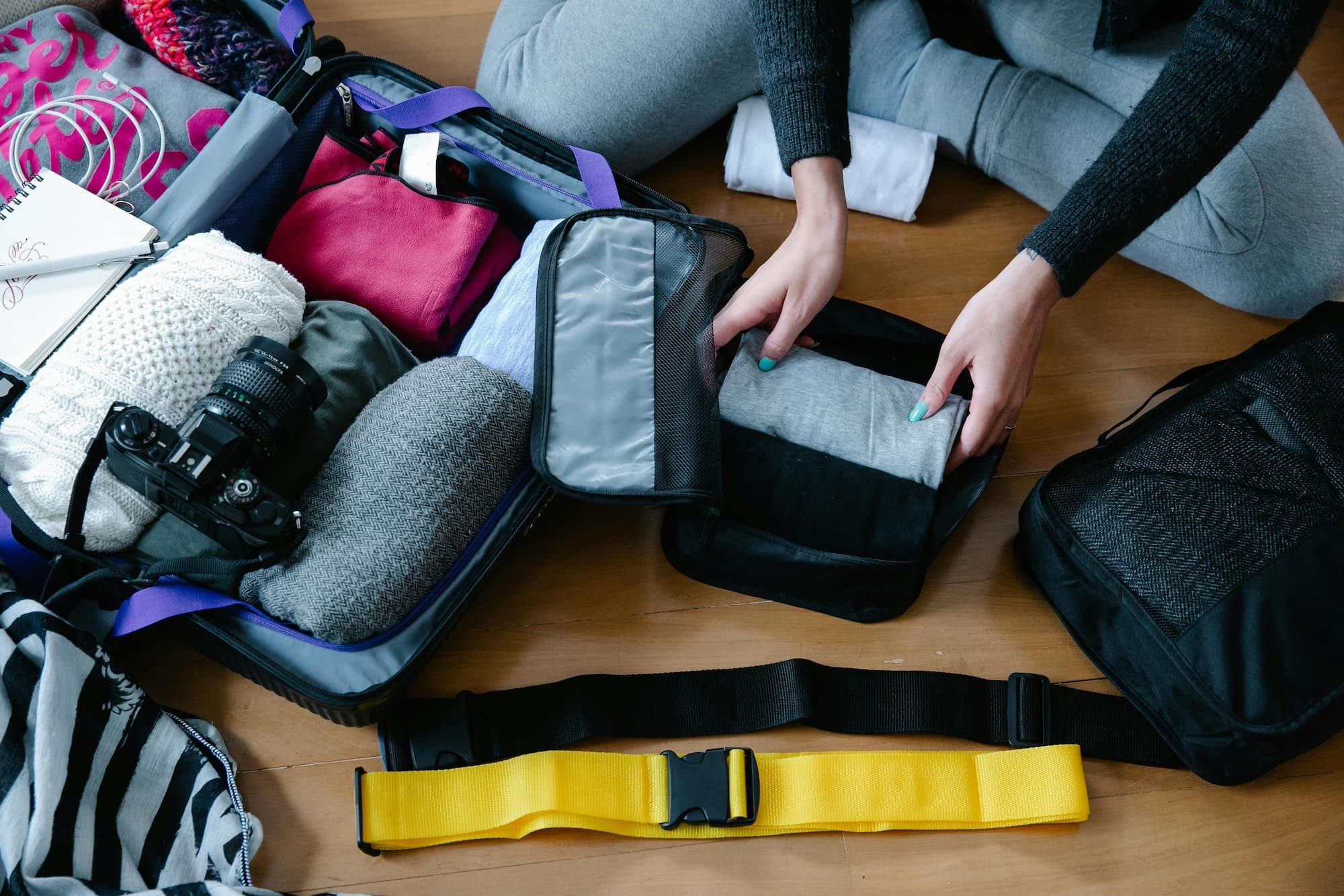 Person packing in a packing cube