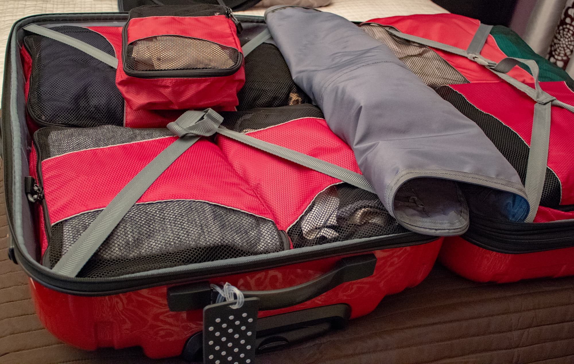 An open suitcase with packing organizers