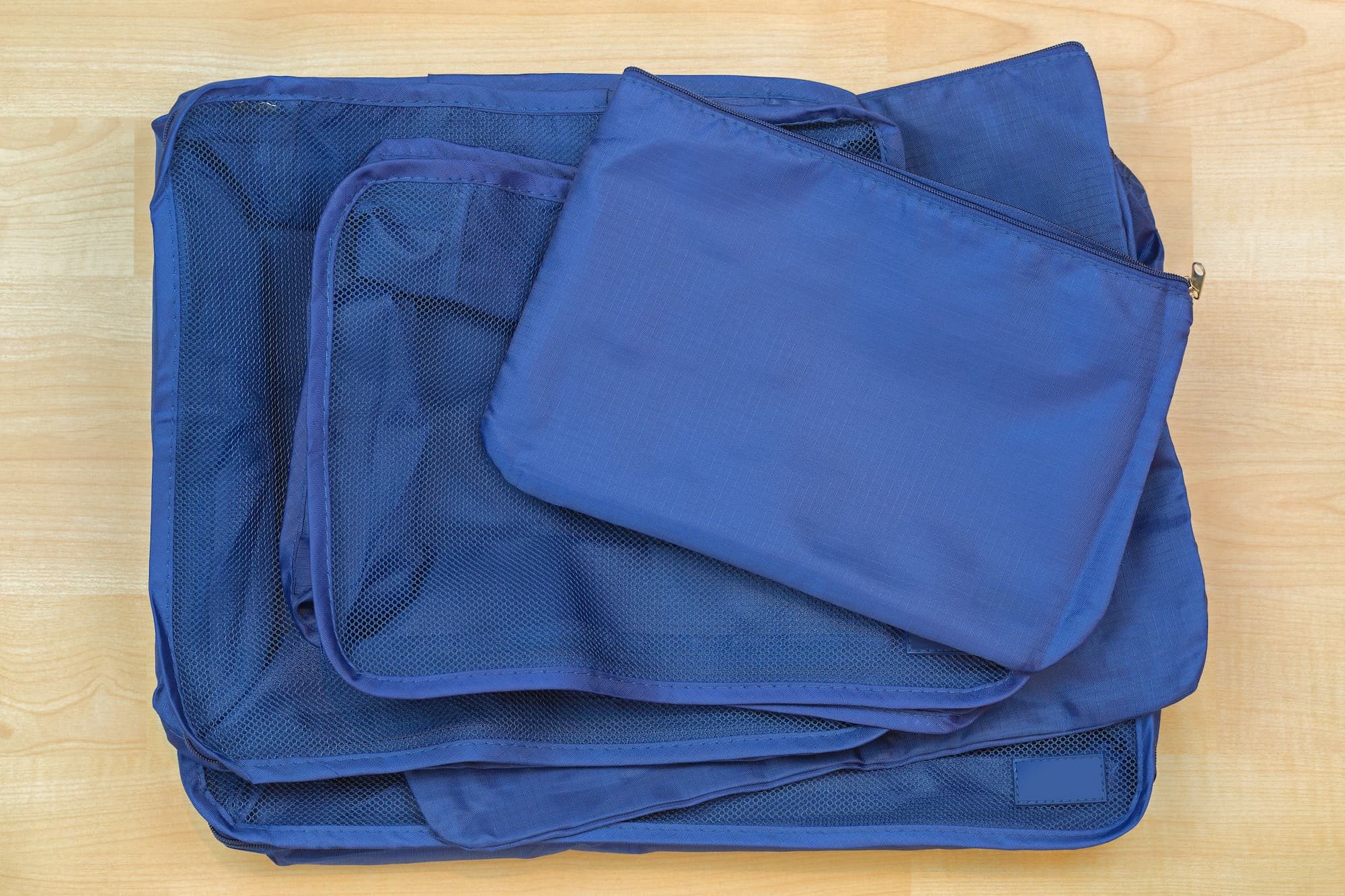 blue cube bags, set of travel organizers to help pack luggage easy and organized