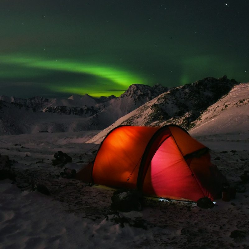 Tent camping in the winter with northern lights