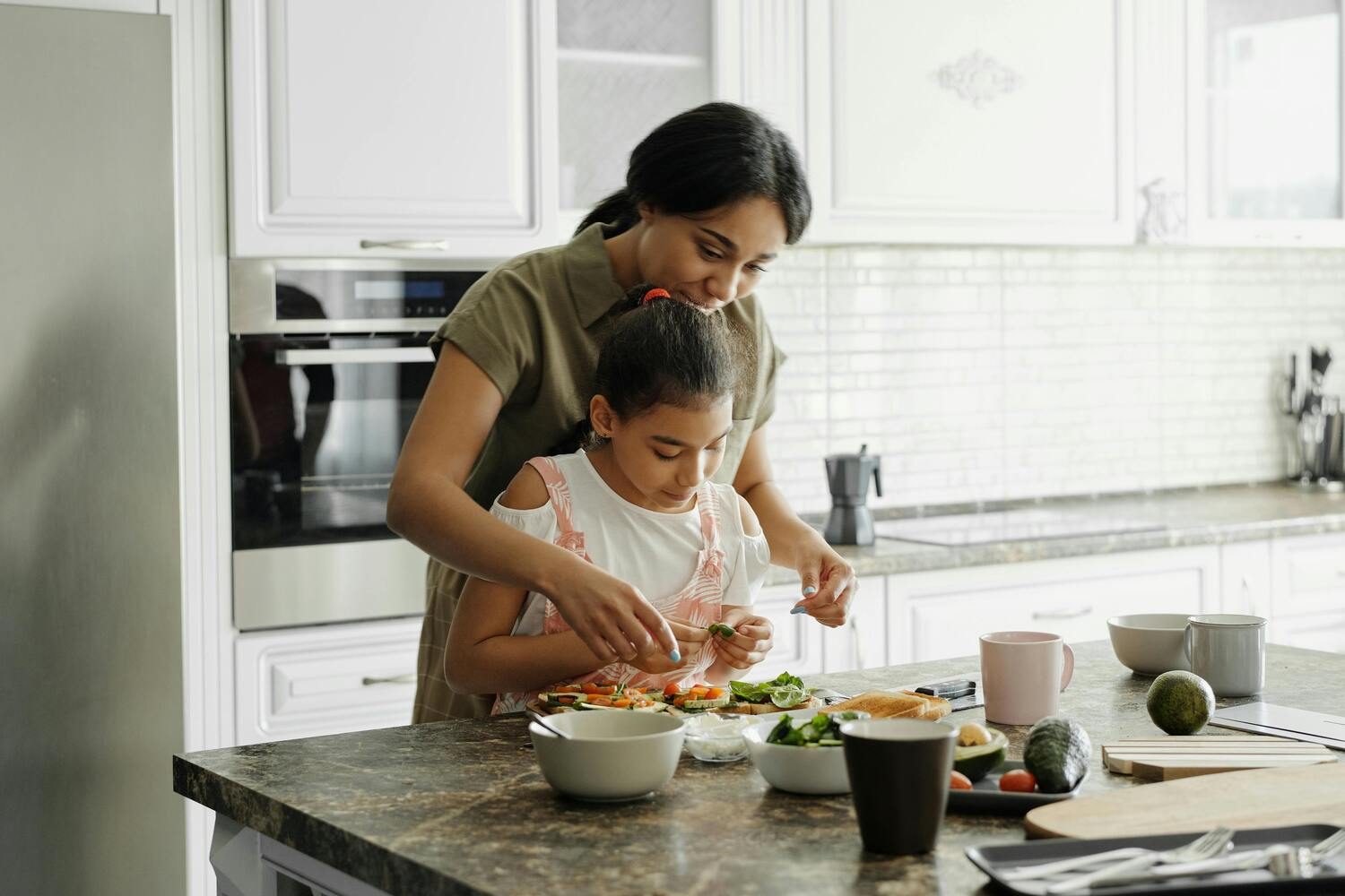 Woman and child cooking