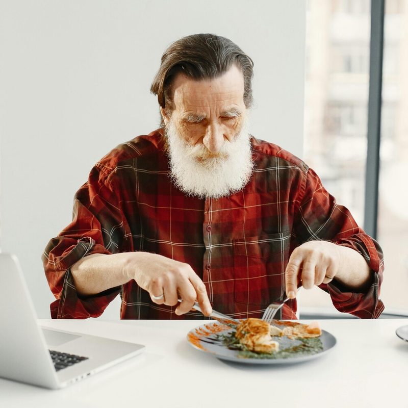 Man eating chicken