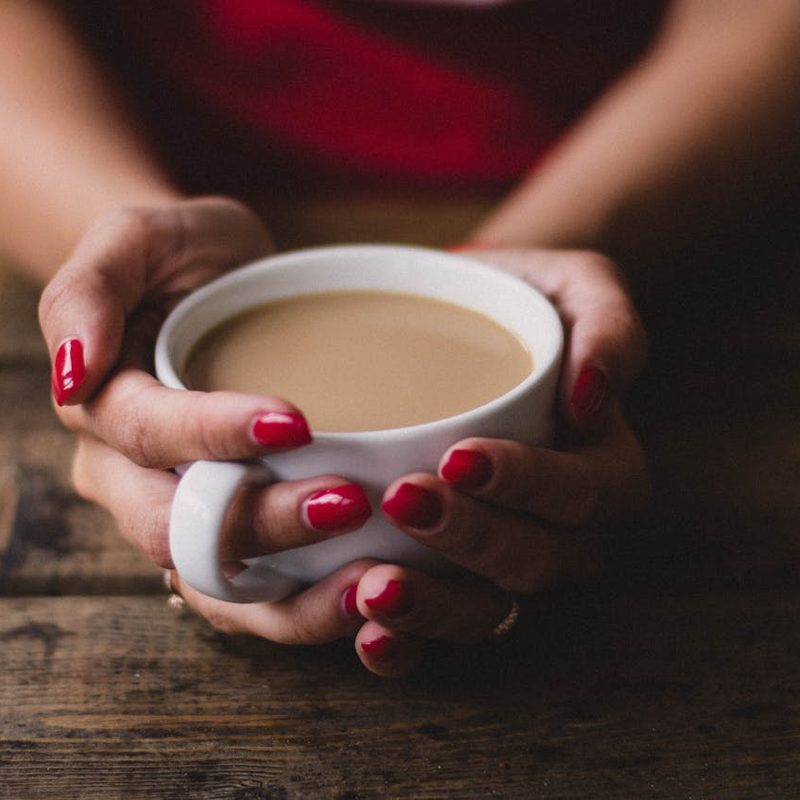 Holding a cup of coffee