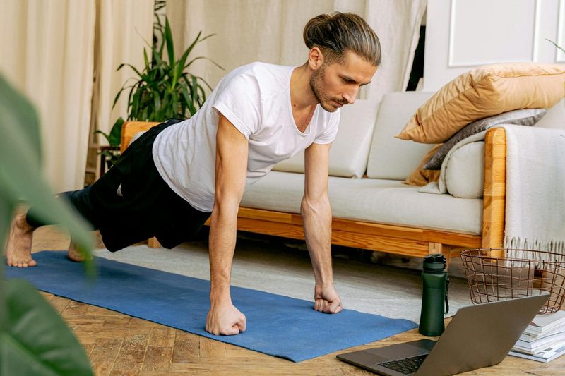 Man doing a plank on a yoga mat