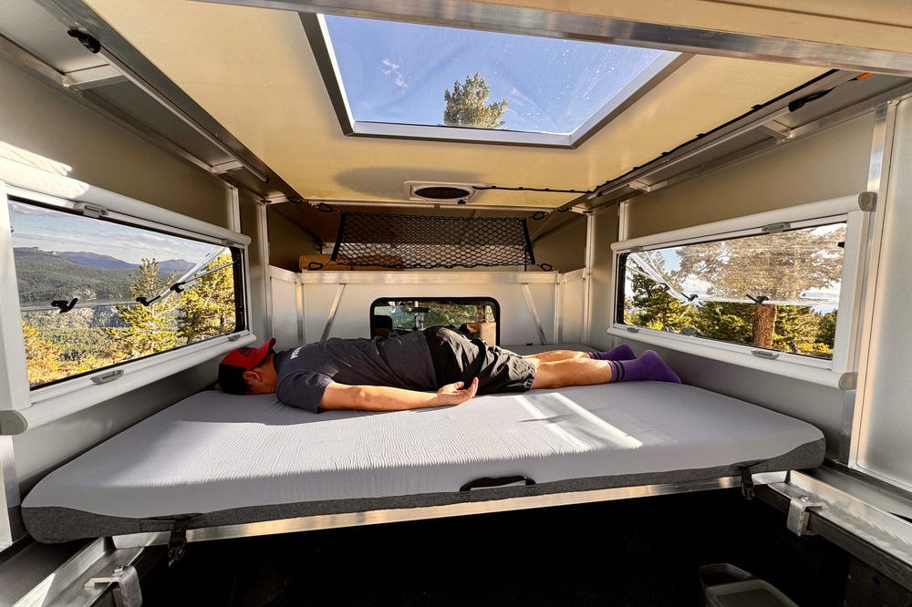 Side-to-side mattress setup inside the Moonlander X hardshell truck camper.