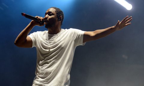 rapper Kendrick Lamar in concert on stage