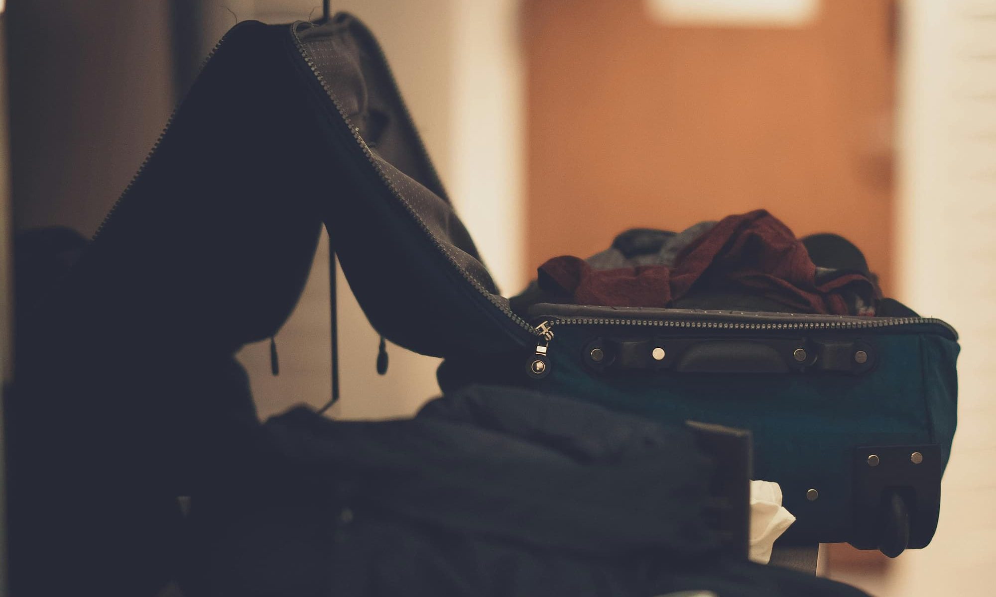 open suitcase with clothes inside