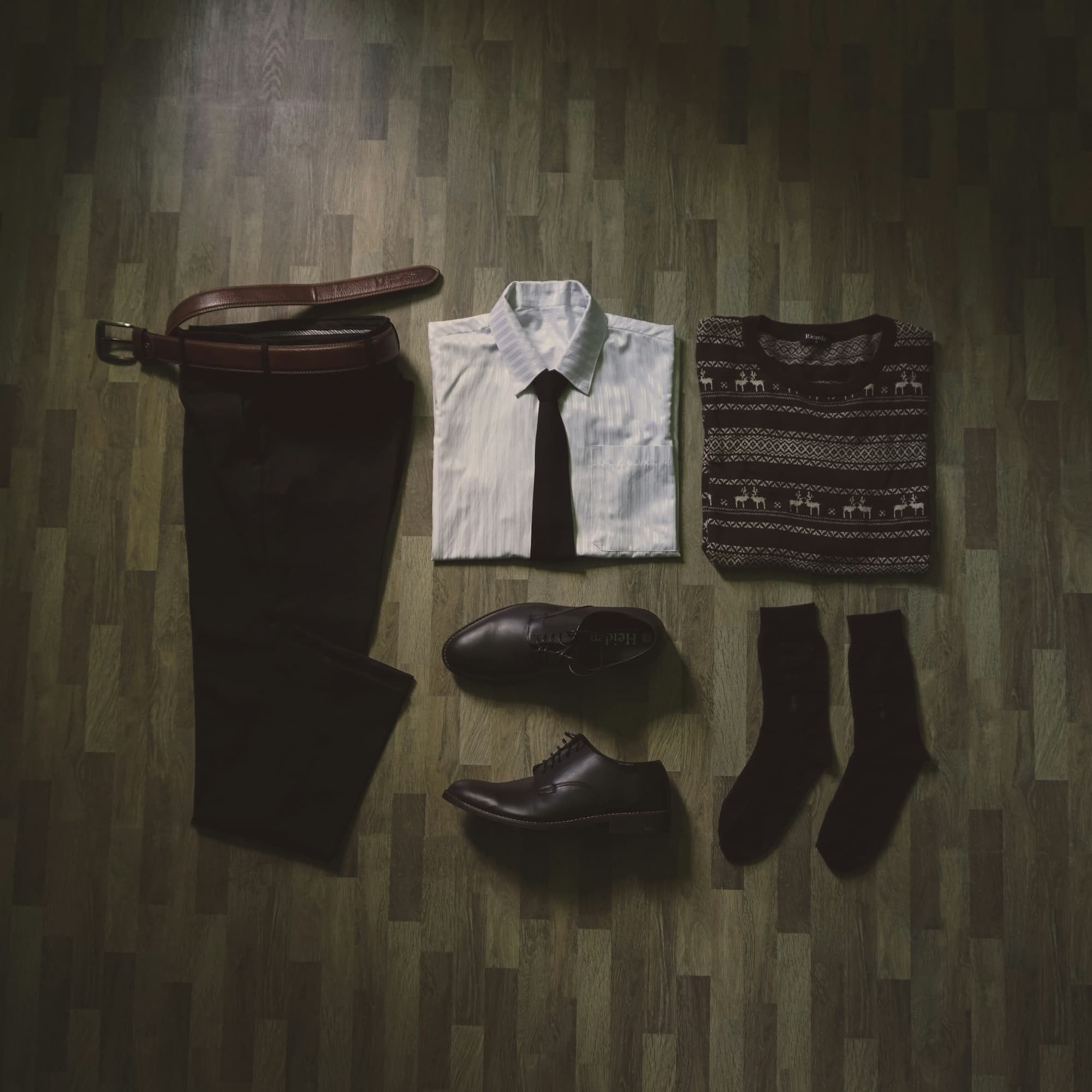 folded suit accessories on ground