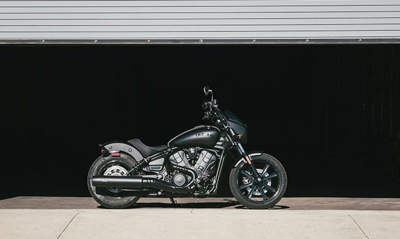 2025 Indian Sport Scout Sixty just inside a garage with the garage door partly raised.