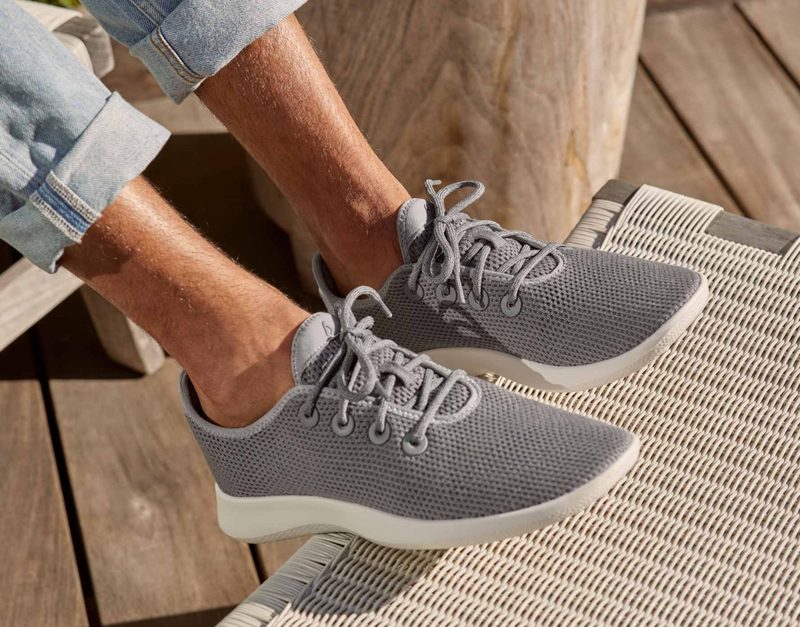 man wearing grey allbird sneakers