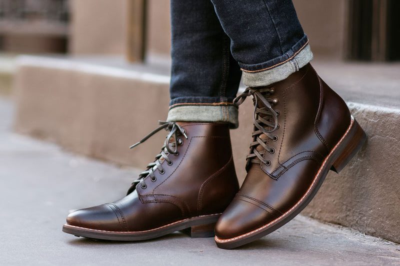 man wearing brown leather boots