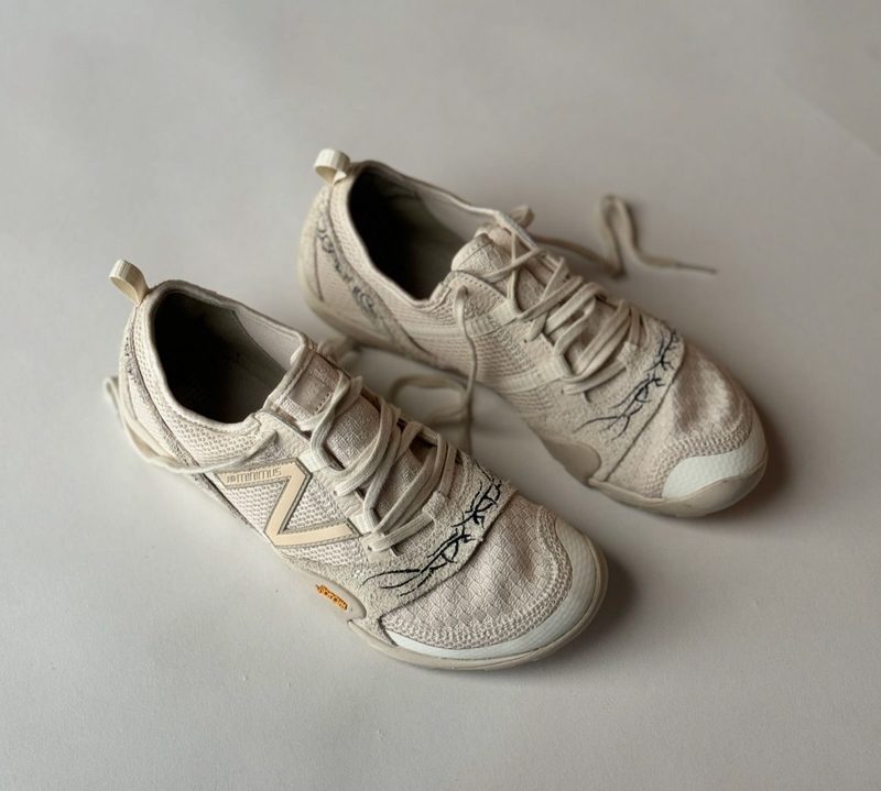 overhead view of New balance sneakers on table