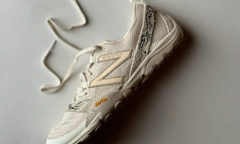 new balance beige sneaker on table