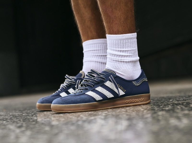 model wearing blue gazelle sneakers