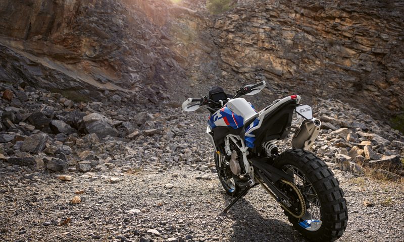 BMW Motorrad BMW Concept F 450 GS parked in the desert facing a mountainside left rear three-quarter view.