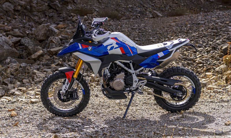 BMW Motorrad BMW Concept F 450 GS parked on dirt with a mountainside in the background left profile.,