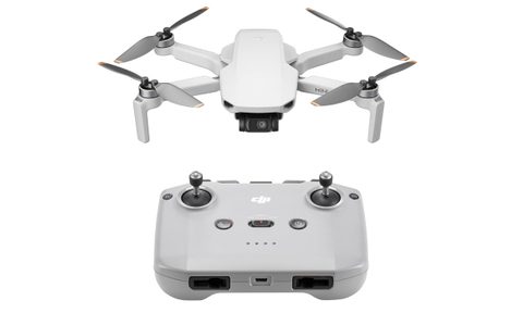 A DJI Mini 4K drone with its controller.