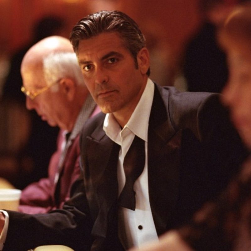 Danny Ocean in a tux at a slot machine