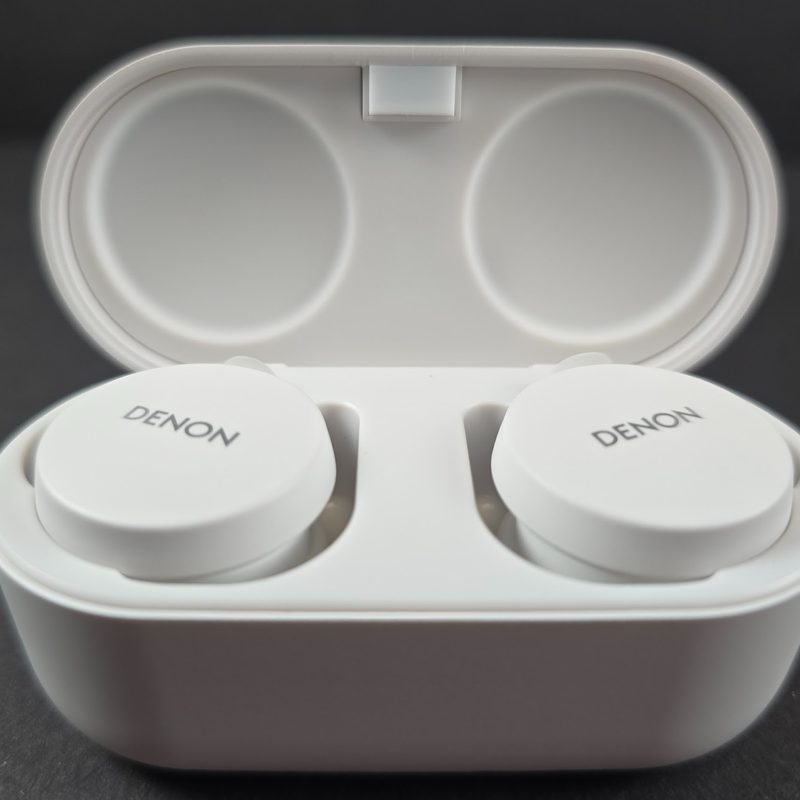 Close up of a pair of Denon headphones in the case