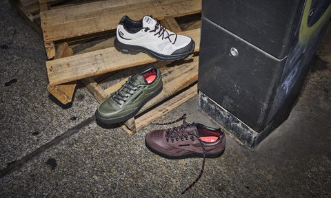 three sneakers in the street