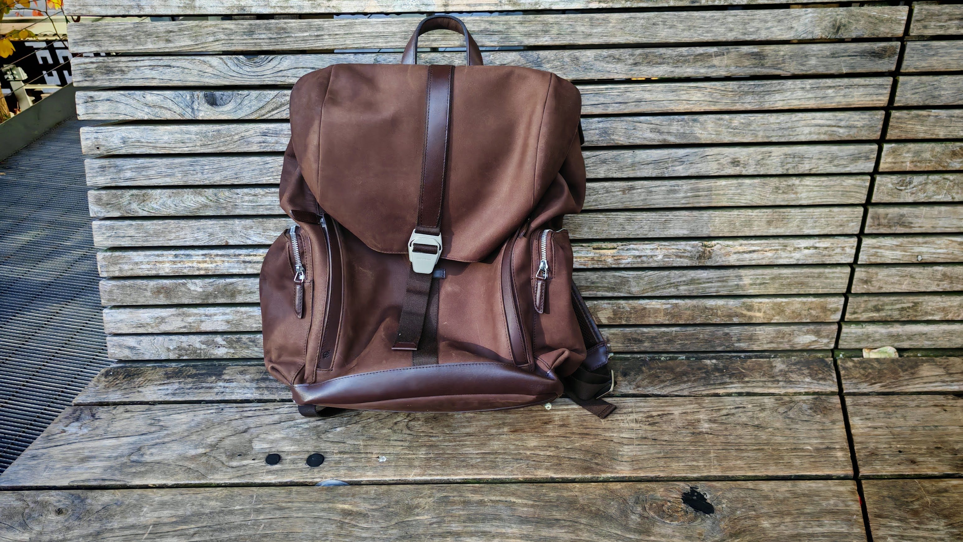 Carl Friedrik Traverse Backpack on a bench