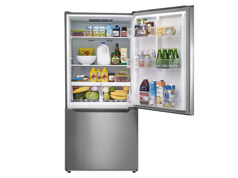 The Insignia 18.6 Cu. Ft. Bottom Freezer Refrigerator with the top compartment open.