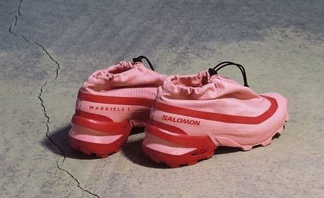 pink sneakers on concrete